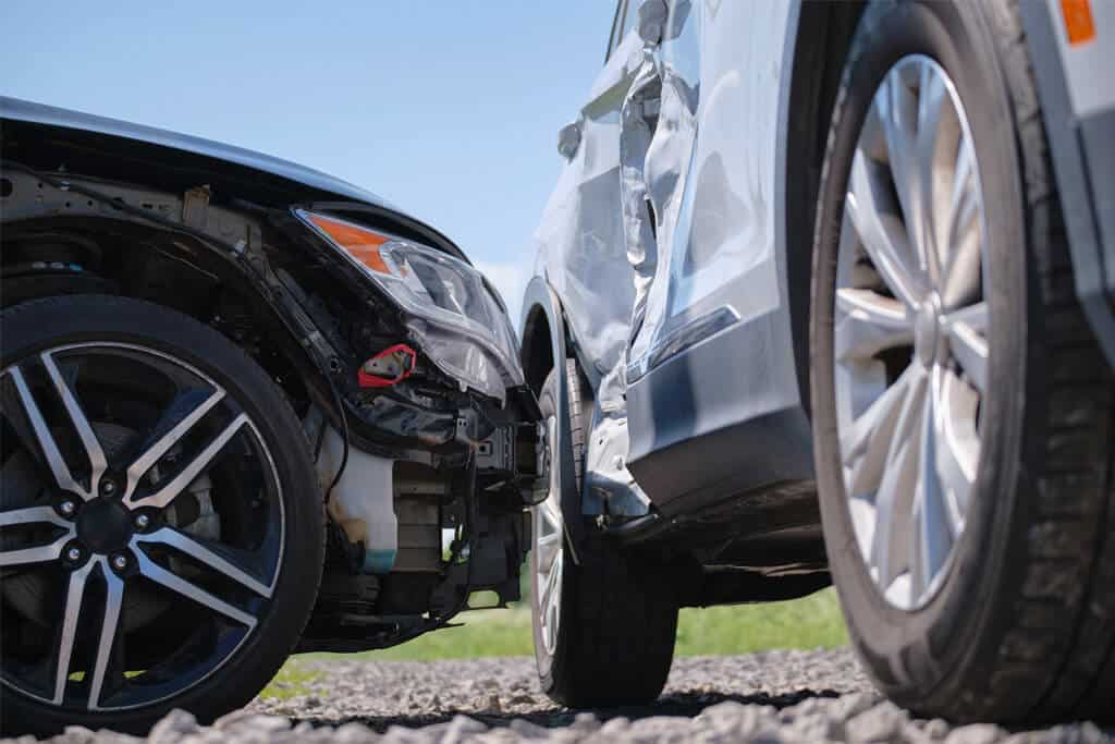 Vehicles damaged after collision on a street.